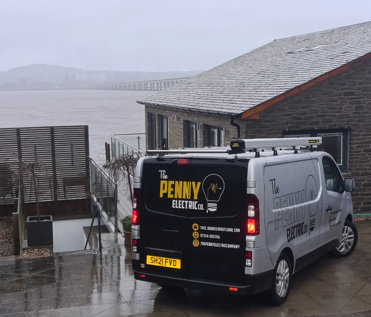 Penny Electric van outside a riverside property in Dundee